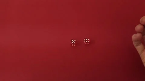 Throwing the dice. Red cubes with white dots on red background Video stock 326243115