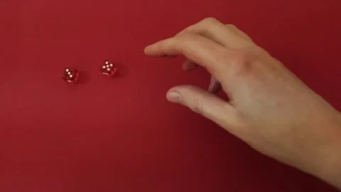 Throwing the dice. Red cubes with white dots on red background Stock Footage 326243168