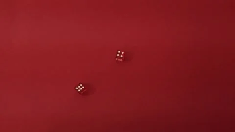 Throwing the dice. Red cubes with white dots on red background Stock Footage 326243171