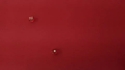 Throwing the dice. Red cubes with white dots on red background Video stock 326243177