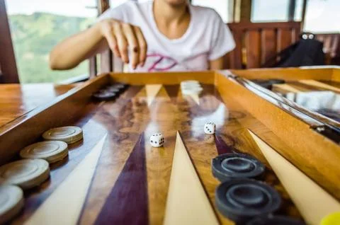 Throwing dices for the backgammon board game Stock Photos