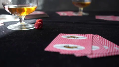 Throwing dices on the black table and checking playing cards with winning combin Stock Footage 133156076