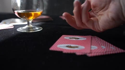 Throwing dices on the black table and checking cards with winning combination Stock Footage 133156243