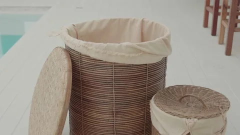 Throwing dirty laundry inside a laundry basket Video stock 194009269
