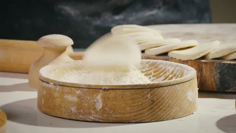 Throwing dough circle in flour Stock Footage 138126484