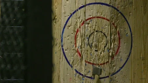 Throwing Felling Axe and Hitting Wood Target in Slow Motion Video stock 93533406