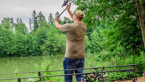 Throwing a fish hook into the water and waiting for the fish to catch Stock Footage 112184563