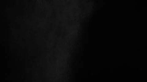 Throwing flour on a black background. White dust falling effect. Stock Footage 303140332