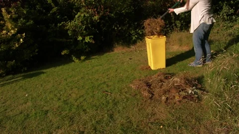 Throwing food scraps waste into compost bin Stock Footage 340357652