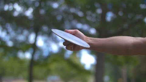 Throwing a Frisbee Disc Stock Footage 91666770