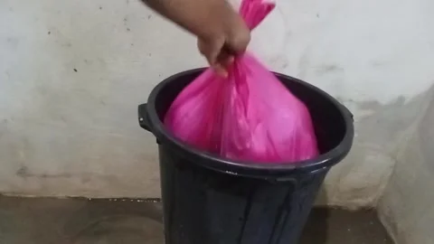 Throwing garbage into the dustbin Stock Footage 315812792