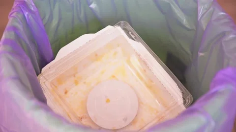 Throwing garbage into a trash bag, basket close-up. Cardboard packaging Stock Footage 150193178