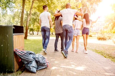 Throwing garbage into the trash can. Stock Photos