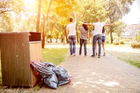 Throwing garbage into the trash can. Stock Photos