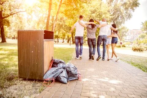 Throwing garbage into the trash can. Stock Photos