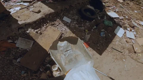 Throwing garbage in the trash Stockbeeldmateriaal 334633794