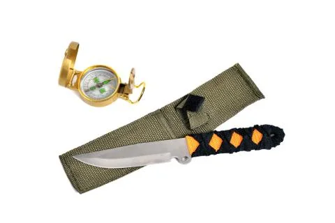 Throwing knife and compass, white background close-up Stock Photos