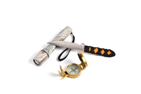 Throwing knife camouflage flashlight and compass on a white background close- Stock Photos