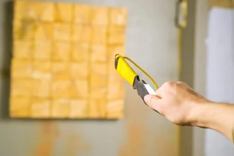 Throwing knife in hand aiming at target. Stock Photos