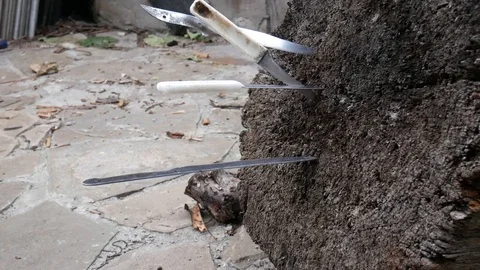 Throwing knives into a tree stump Stock Footage 113742910