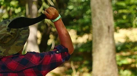 Throwing machete to the tree, Throwing knife in the trunk of the tree slowmotion Stock Footage 58599499