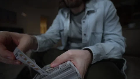 Throwing Money From Stack Toward Camera Video stock 322946352