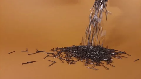 Throwing nails on a orange background Stock Footage 229010876