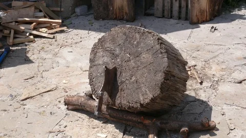 Throwing an old hunting axe to the tree stump Stock Footage 113742737