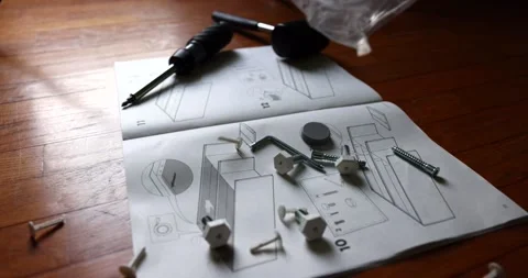 Throwing out from a plastic sacket some general fixings like screws and pegs Stock Footage 150392985