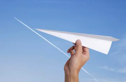 Throwing a paper airplane Stock Photos