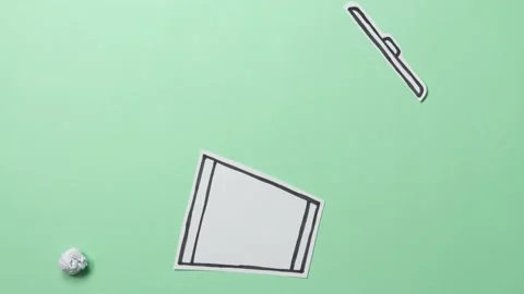 Throwing paper balls into the trash can. Stop motion and cut out animation. Stock Footage 137970363