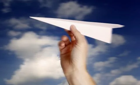 Throwing a paper plane.. Stock Photos
