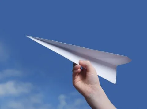 Throwing a paper plane.. Stock Photos