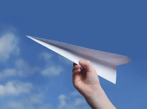 Throwing a paper plane.. , Stock Photos