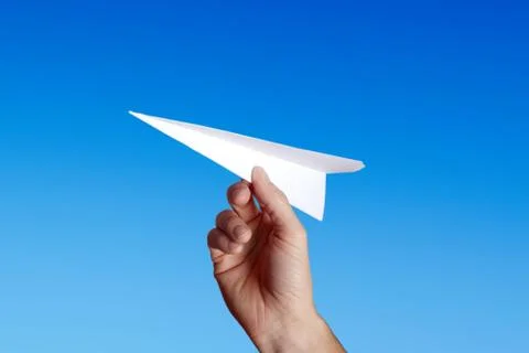 Throwing a paper plane.. Stock Photos