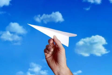 Throwing a paper plane.. Stock Photos