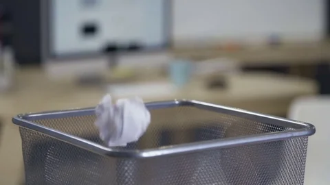 Throwing paper into waste basket Stock Footage 72574848