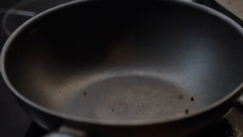 Throwing pepper into wok Stock Footage 97411010