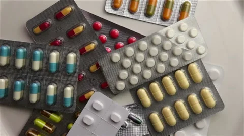 Throwing pill packings on turning plate Stock Footage 7130212