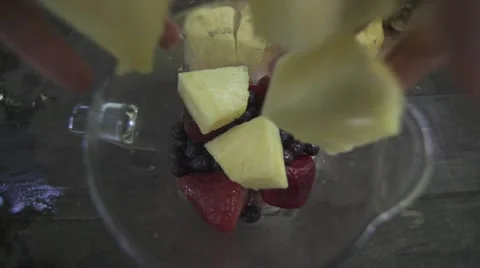Throwing Pinneapple in a blender 3 Stock Footage 43133546