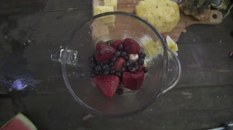 Throwing Pinneapple in a blender Stock Footage 43134063