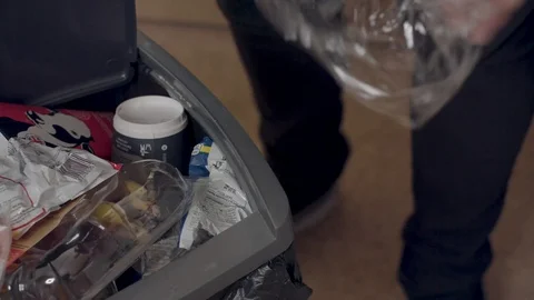 Throwing Plastic in the bin Stock Footage 115254618