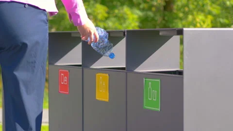 Throwing plastic bottle into the garbage can in 4k slow motion 60fps Stock Footage 165693783