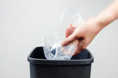 Throwing plastic in the trash. sorting the trash. Stock Photos