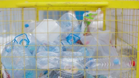 Throwing plastic waste to recyble bin Stock Footage 91140480