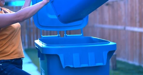 Throwing Recyclable Garbage to the Blue Basket Stock Footage 114480075
