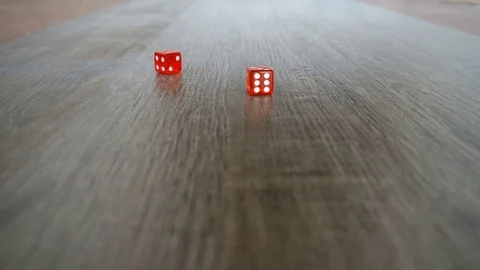 Throwing red dice on a grey background in the casino Video stock 76378488