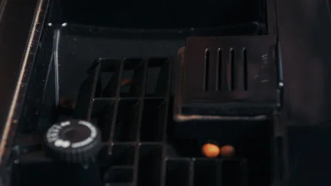 Throwing roasted coffee beans on automatic coffee machine feeder. Narrow focus Stock Footage 213059984