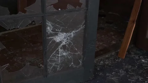 Throwing a rock  at a glass window Stock Footage 182886711