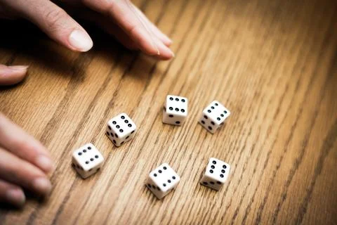 Throwing six dice and getting a perfect score ! Stock Photos